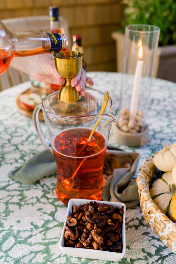 Making Apple Cider Aperol Spritz.