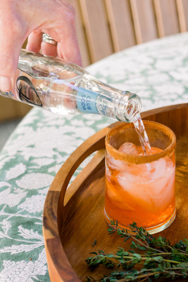 Making Apple Cider Aperol Spritz.
