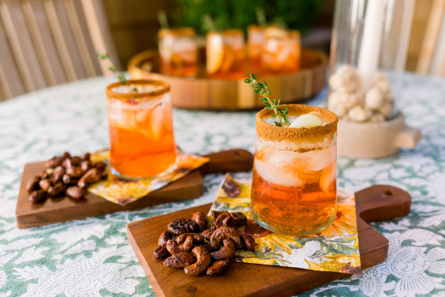 Apple Cider Aperol Spritz and roasted nuts.