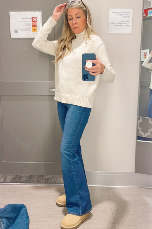 Woman trying on Levi's in Target dressing room.