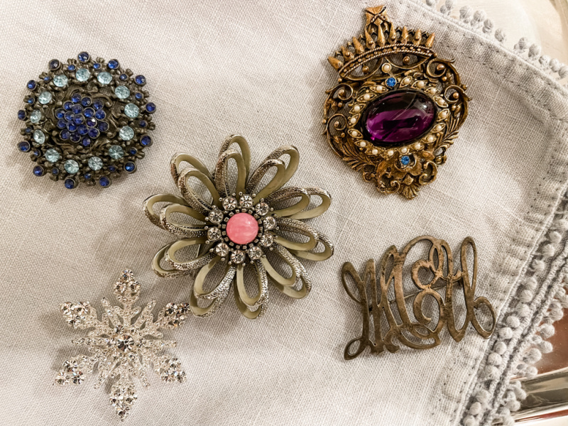 Brooches on a tray.