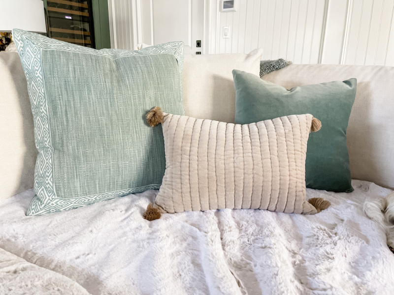 Faux Fur Throw on sofa cushion against throw pillows.