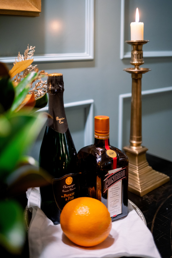 Cara Cara Spritz Ingredients on silver tray on bar.