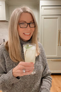 Woman holding glass of lemonade.