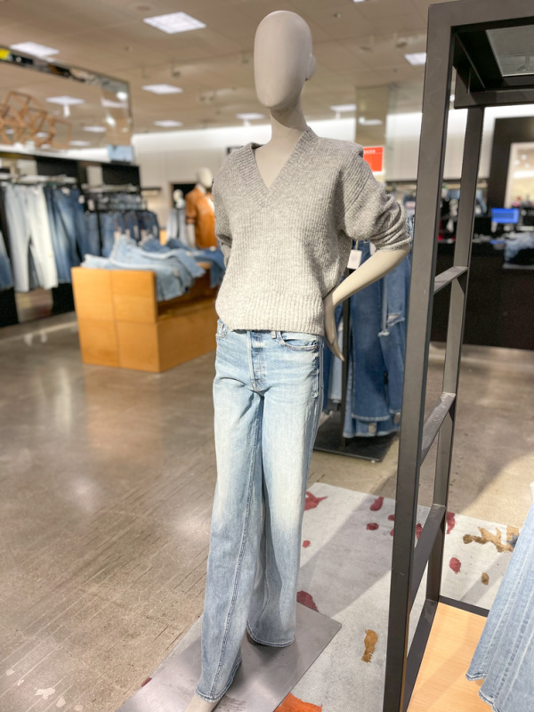 Mannequin at Nordstrom in jeans and grey sweater.