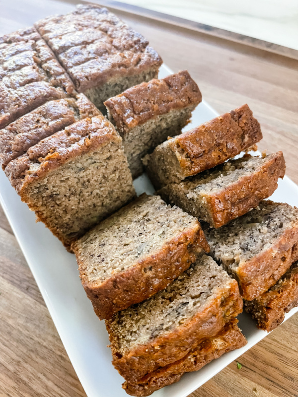 Sliced banana bread on a platter.