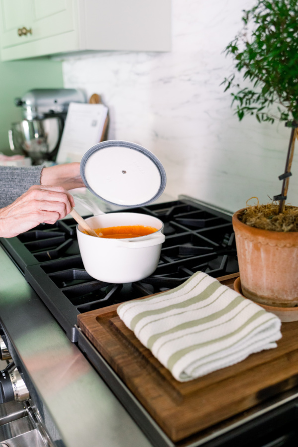 Pot of tomato soup on stove.