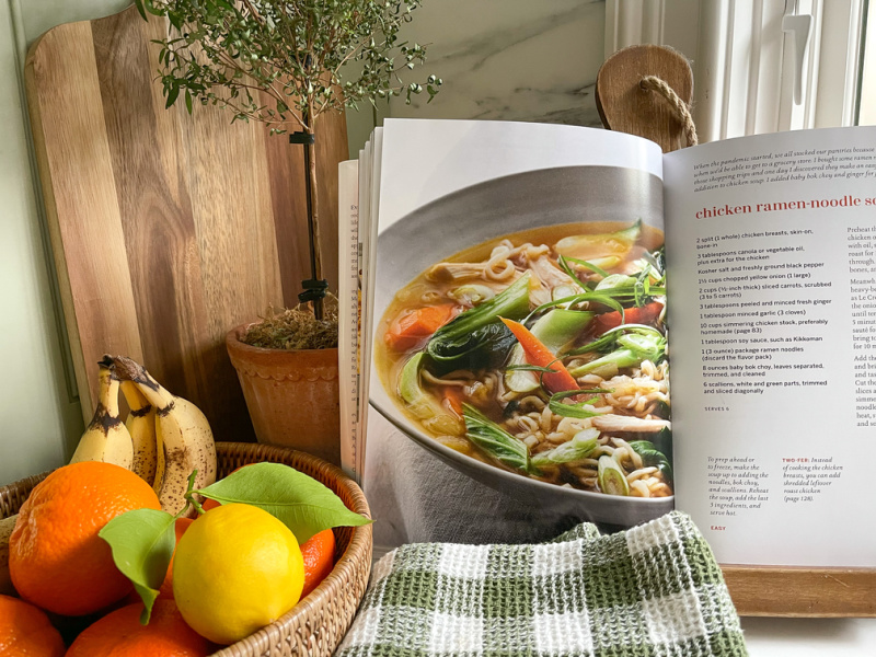 Go-To-Dinners cookbook on rack in kitchen.