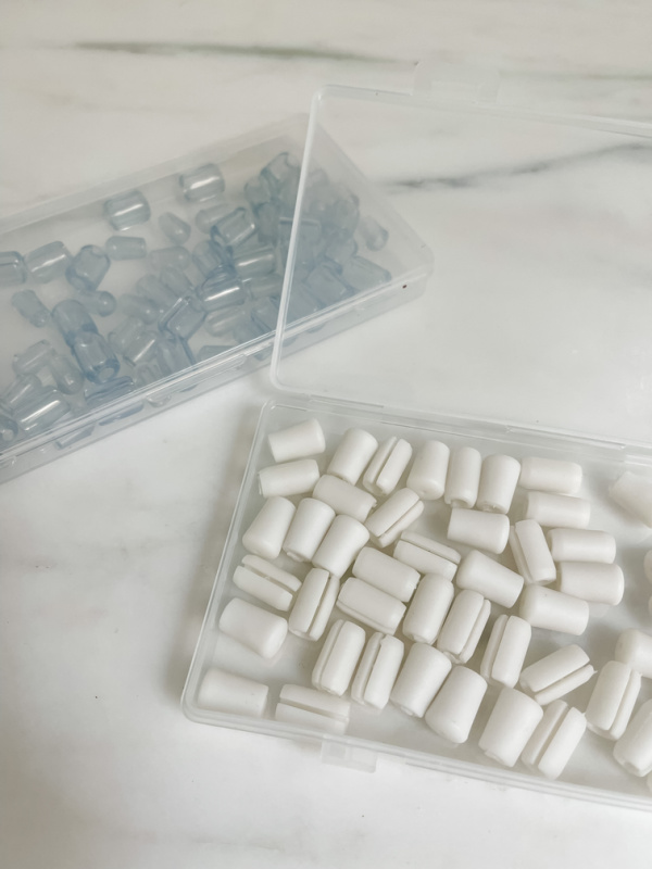 Two boxes of platstic covers.