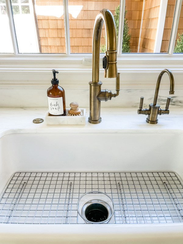 Kitchen sink with aluminum rack.