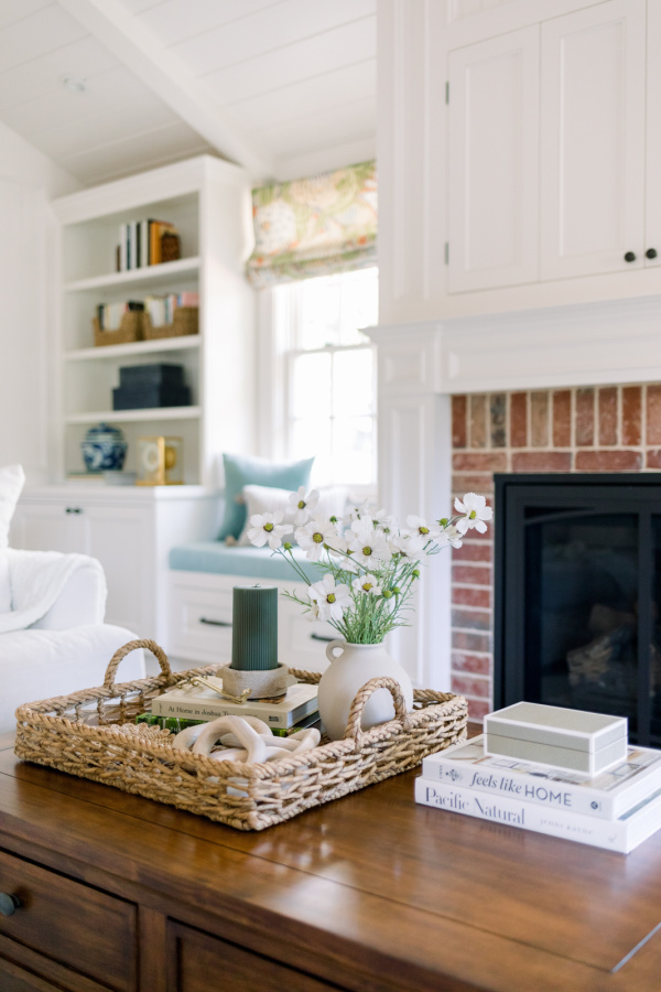 Coffee table with woven basket and spring touches.