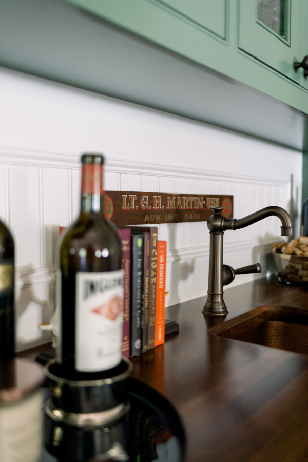 Bottle of wine on wet bar.