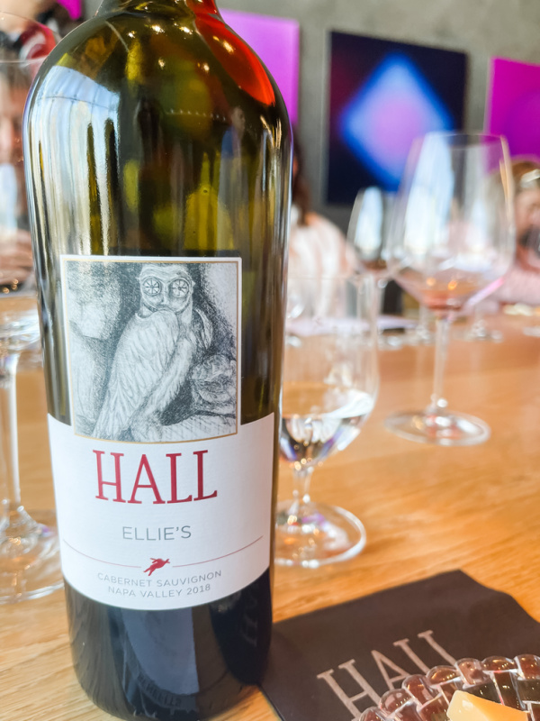 Hall wine bottle on tasting table.