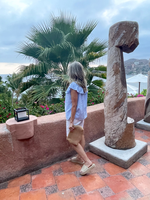 Woman wearing J.Crew Bermuda short and stripped top.