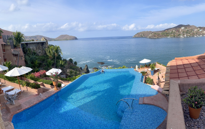 Infinity edge swimming pool over looking pacific ocean in Zihautanejo.