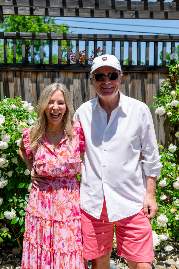 Couple laughing at baby shower.
