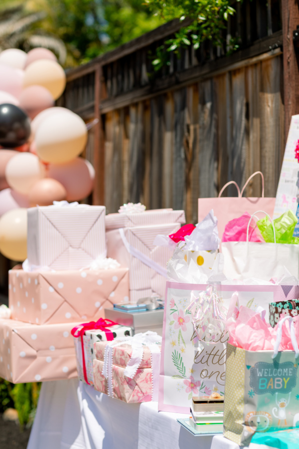 Gift table at baby girl shower.