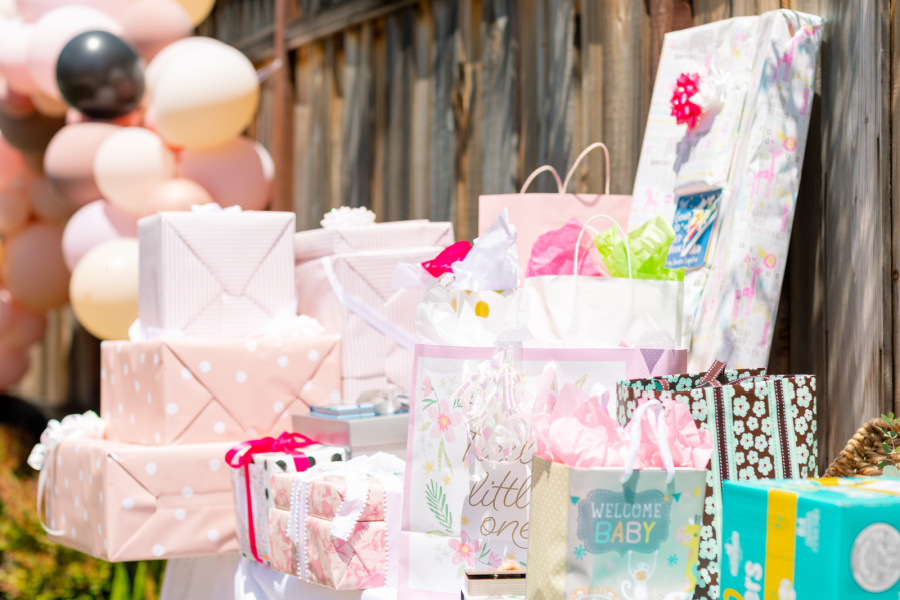 Baby girl shower gift table.