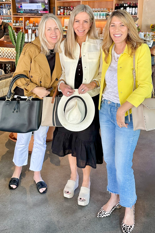 Three women posing in Mexican restaurant bar.