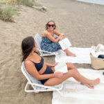 Two woman chatting on the Bach.