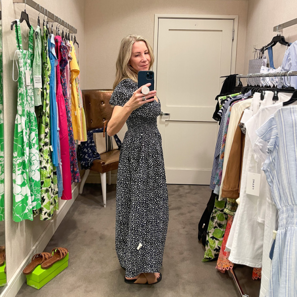 Woman wearing La Ligne dress in Nordstrom dressing room.