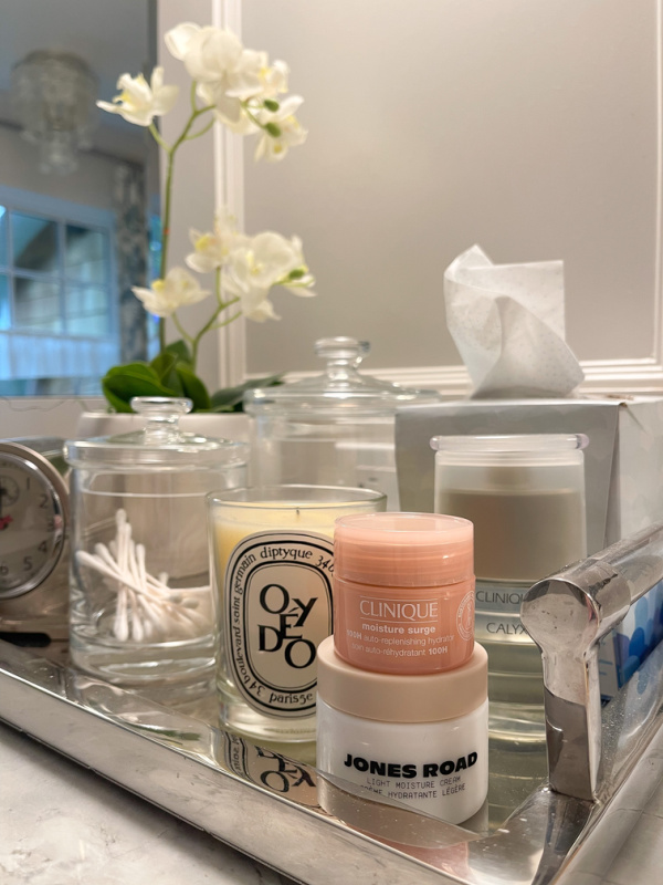 Clinique Moisture Surge on vanity counter.