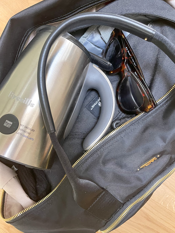 Tumi carryall bag with Breville milk frother thrown in.