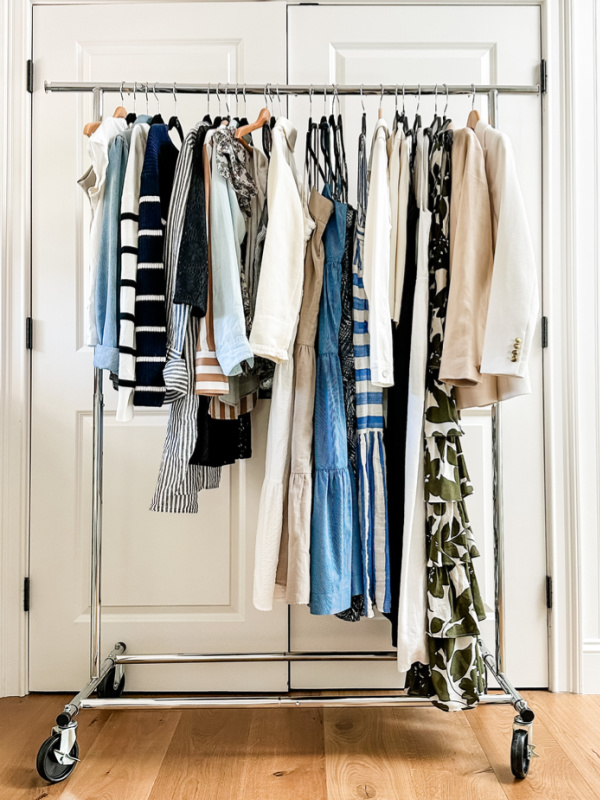 Rolling rack of clothes to pack for a week in Italy.