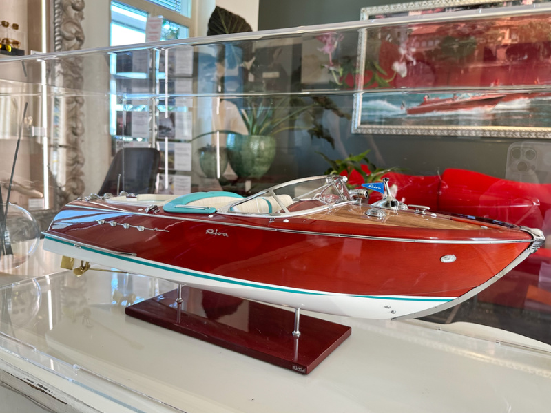 Riva model boat in hotel lobby.