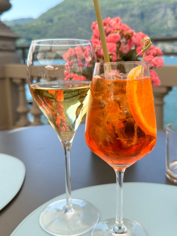 Aperol Spritz and wine overlooking Lake Como.