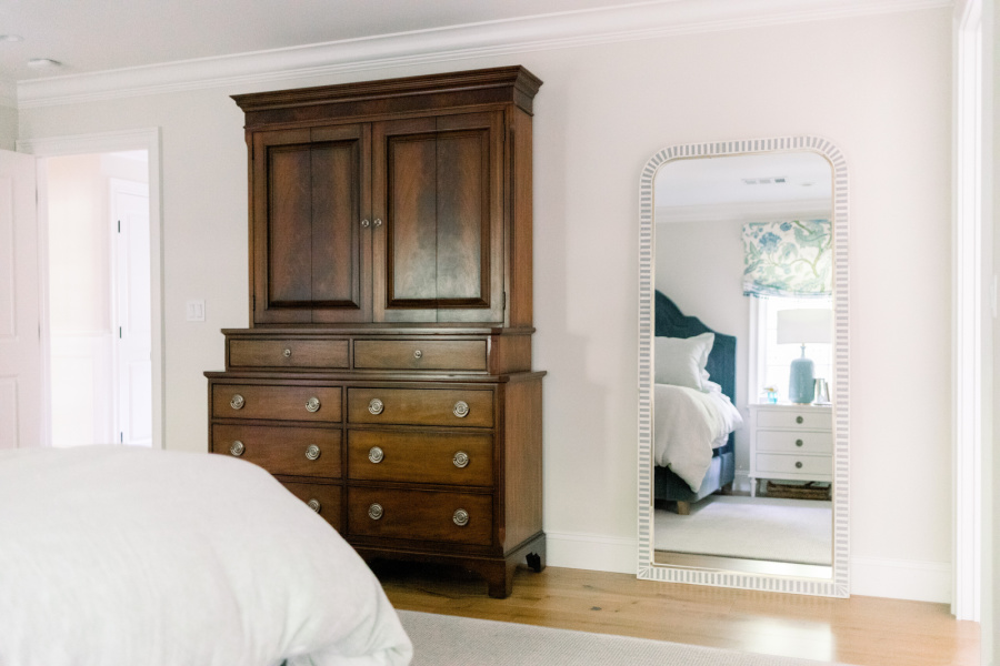 Bedrroom TV armor and standing mirror.