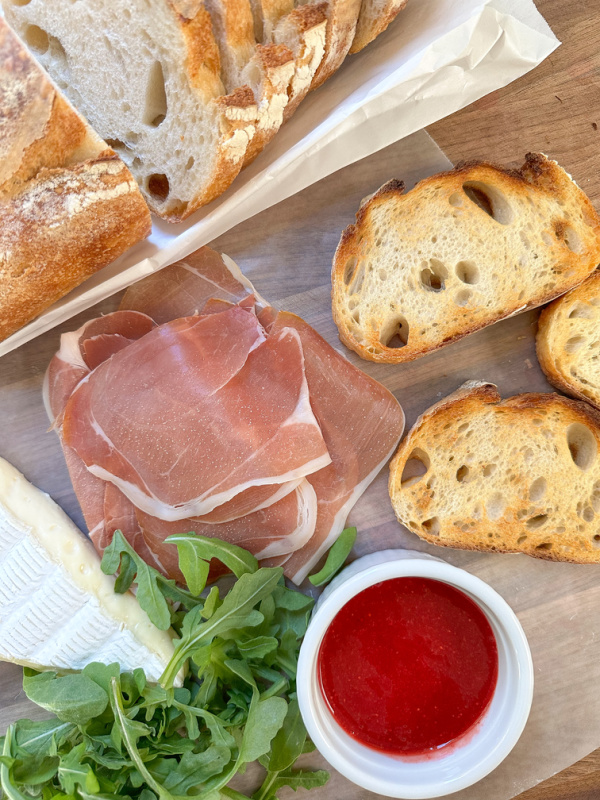 Ingredients to make prosciutto and brie tartine.