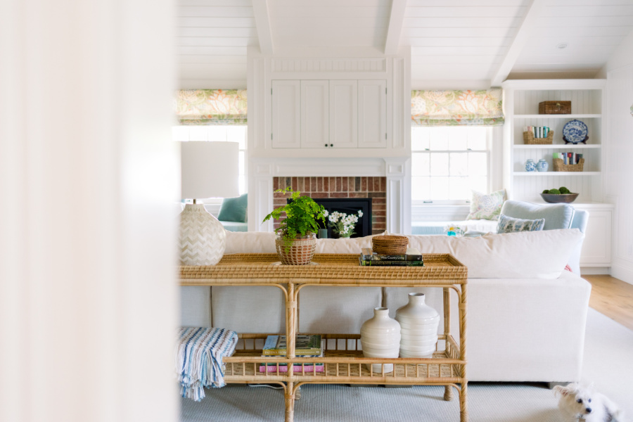 Picture looking into great room and back of woven sofa table.