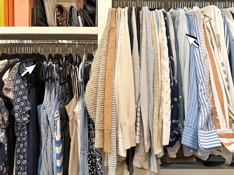 Woman's closet clothing racks.