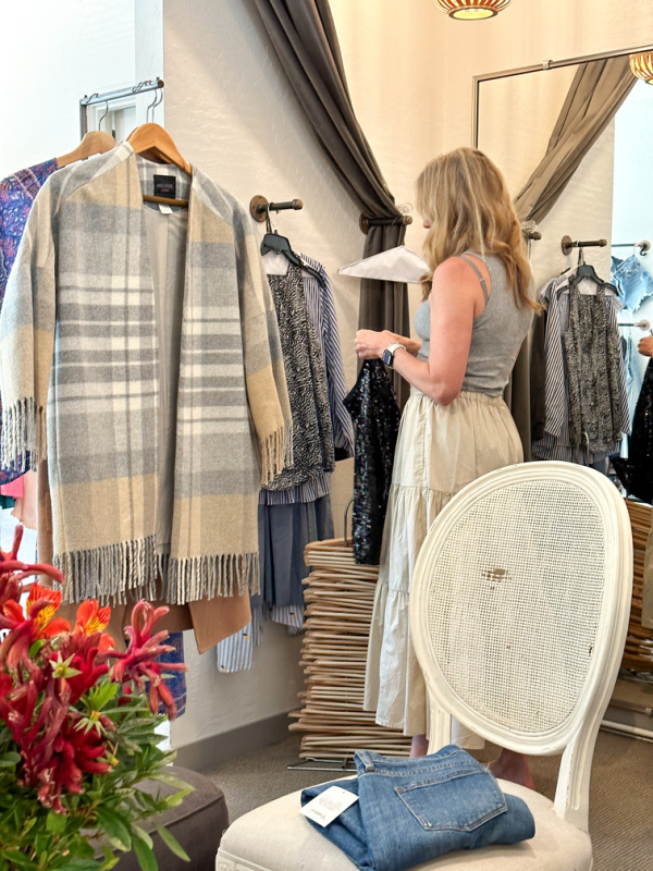 woman checking new merchandise at Rechic store.