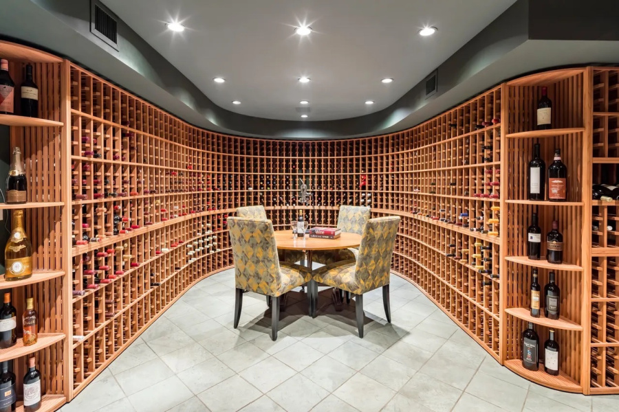 Curved wine room.