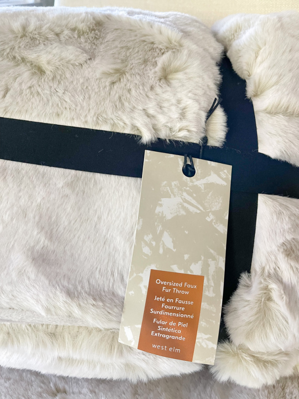 West Elm Faux Fur Throw in packaging.
