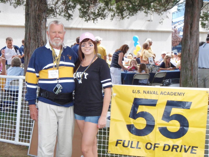 Grandpa and granddaughter at Navy Marine Corp Memorial Stadium tailgate.