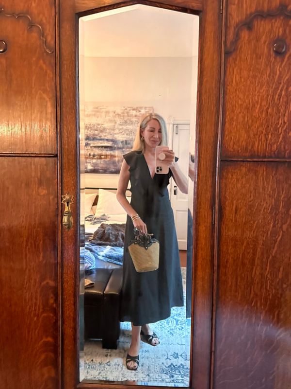 Woman taking selfie in mirror.