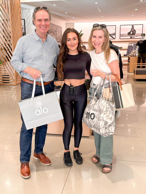 Couple with their niece at Alo Yoga store.