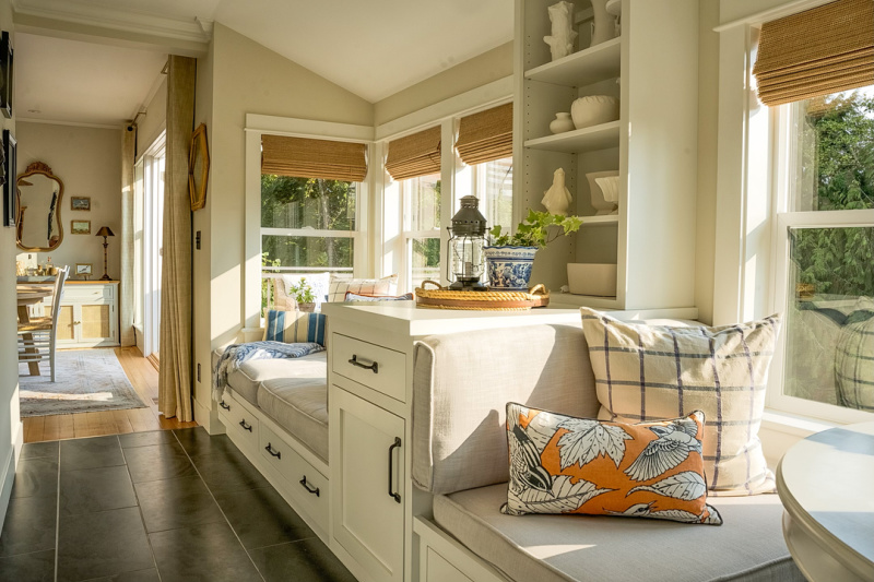 Window seat and banquette in pretty PNS home.
