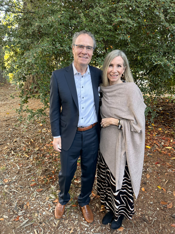 Couple standing outside wedding chapel.