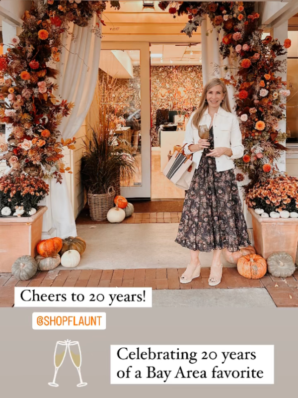 Woman in Ulla Johnson dress standing outside Flint boutique in Danville, CA.