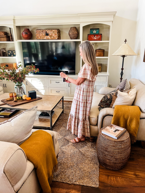 Woman taking photo in beautiful living room.