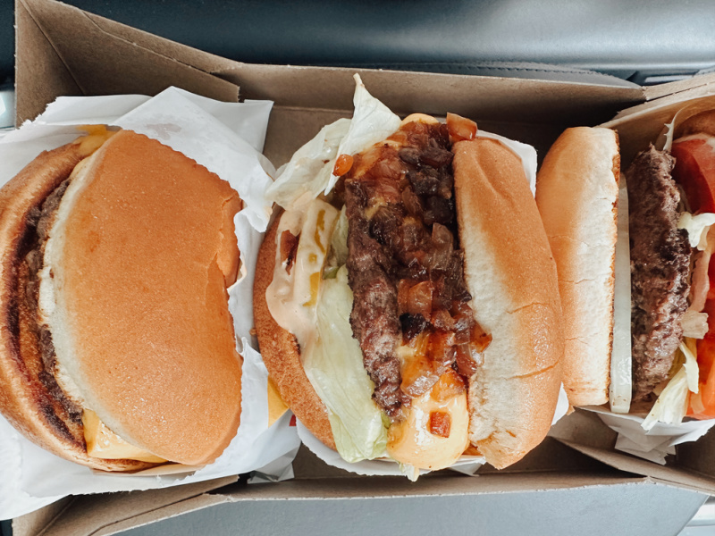 Photo of three burgers in a box from In N Out.
