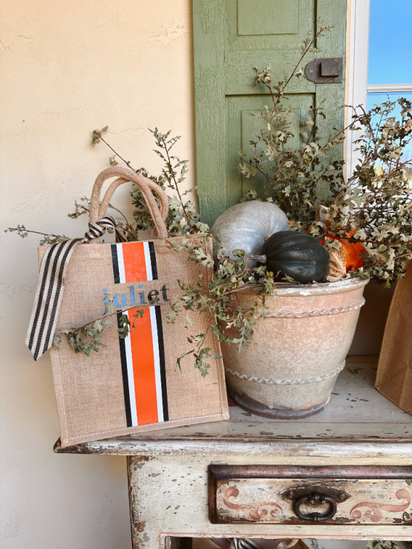 Fall themed gift bag on foyer console.