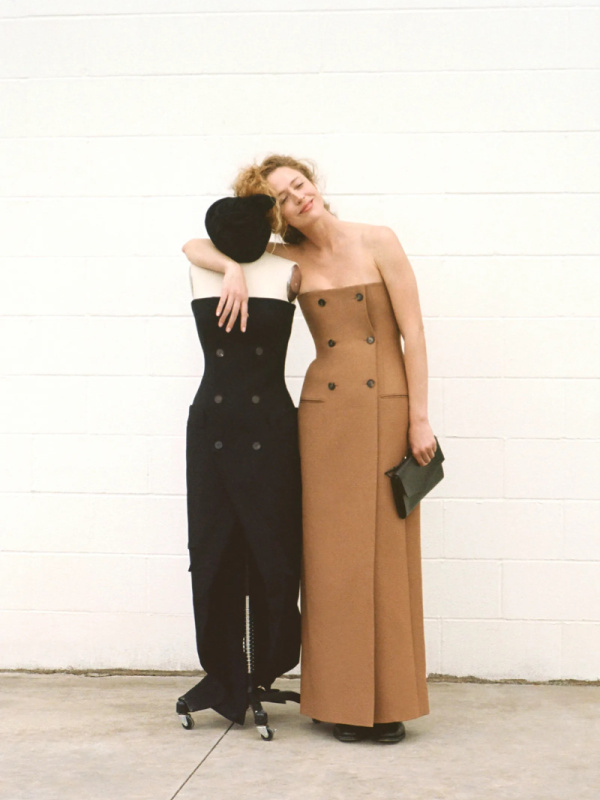 Woman standing next to mannequin both wearing Stella McCartney bustier dresses.