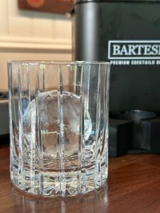 Ice sphere in cocktail glass.