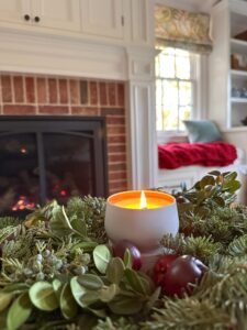 Hood Canal holiday candle sitting on living room coffee table.