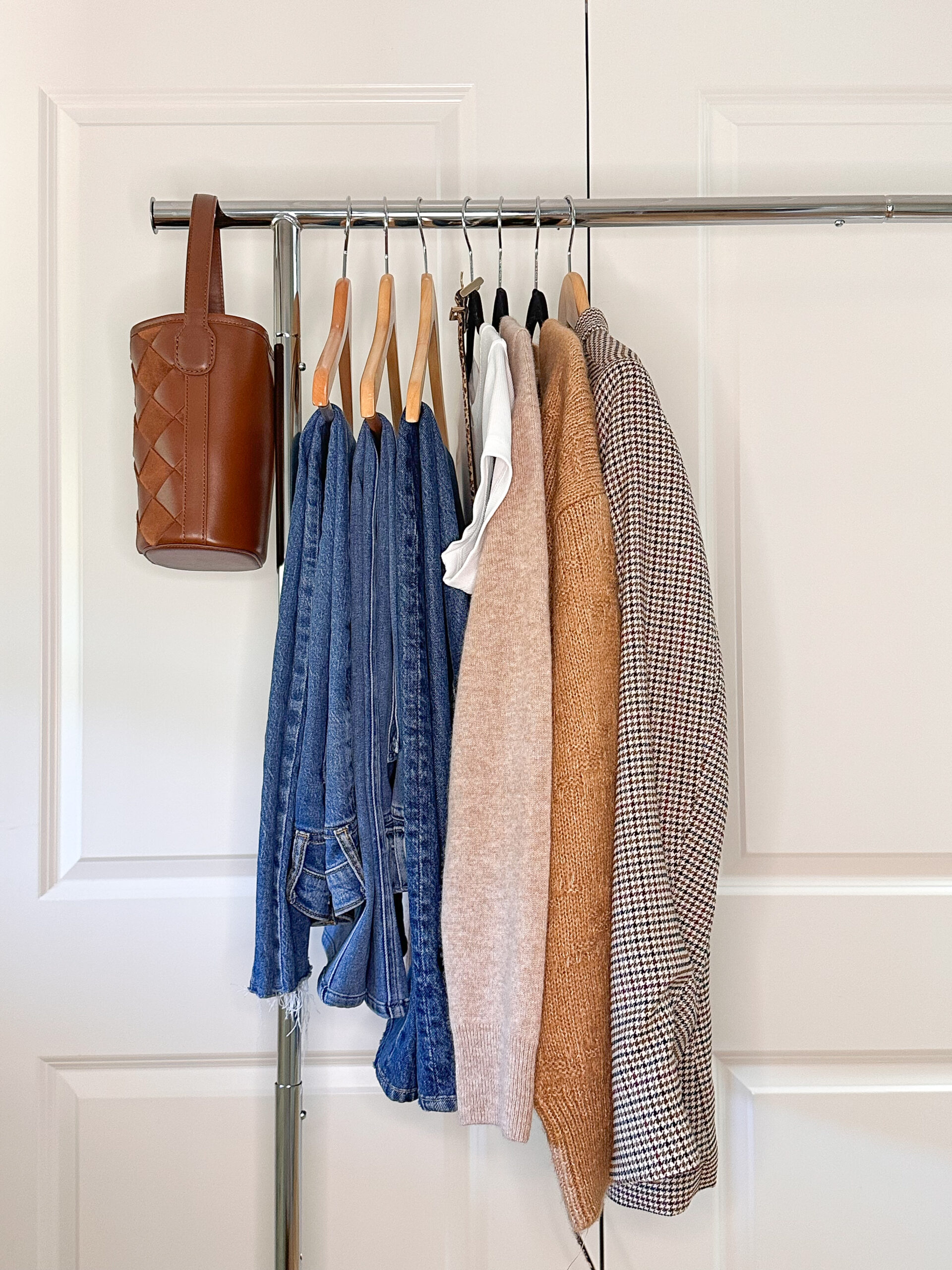 Hanging rack filled will fall capsule wardrobe.